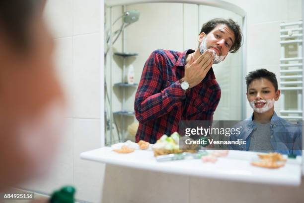 learning to shave - teenage boy shave imagens e fotografias de stock