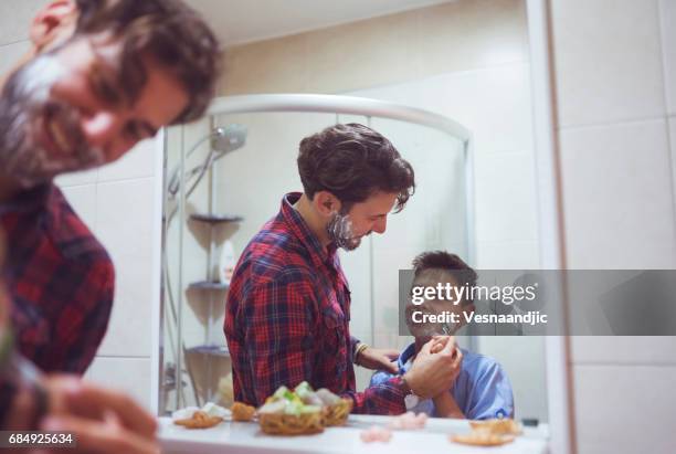 learning to shave - teenage boy shave imagens e fotografias de stock