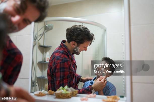 learning to shave - teenage boy shave imagens e fotografias de stock