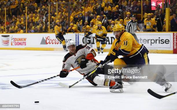 Jakob Silfverberg of the Anaheim Ducks skates against P.A. Parenteau of the Nashville Predators during the second period in Game Four of the Western...
