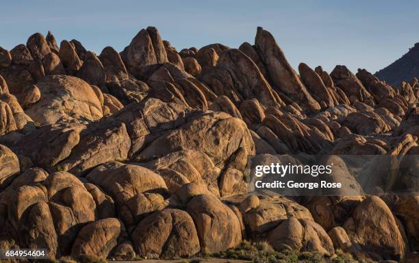 Rock formations in the scenic Alabama Hills are viewed at sunrise on April 6 near Lone Pine, California. Owens Valley is an arid valley in eastern...