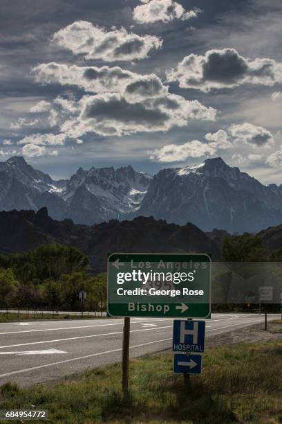 Road sign for Highway 395 is viewed with Mt. Whitney in the background on April 6 in Lone Pine, California. Owens Valley is an arid valley in eastern...