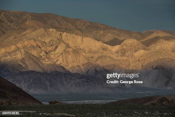 The White Mountains are viewed at sunset from Highway 395 on April 6 in Lone Pine, California. Owens Valley is an arid valley in eastern California,...