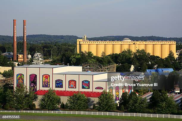 hersheypark with factory in background - hershey stock pictures, royalty-free photos & images