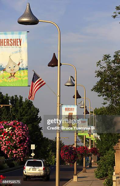 kisses chocolate shaped street lamps on street - street light banner stock pictures, royalty-free photos & images