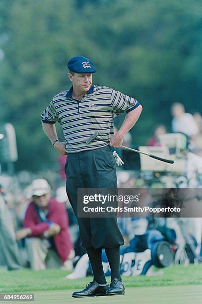 American golfer Payne Stewart pictured holding his putter on a green for Team USA during play to beat Team Europe in the 1999 Ryder Cup, 14.5 - 13.5...