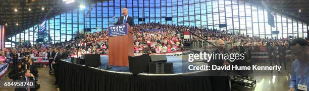 Wide-angle view of American real estate developer and presidential candidate Donald Trump as he speaks from the podium during a campaign rally at...