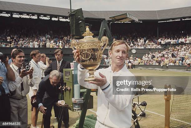 Australian tennis player Rod Laver holds the Gentlemen's singles trophy after winning the Men's Singles final against his fellow countryman Tony...