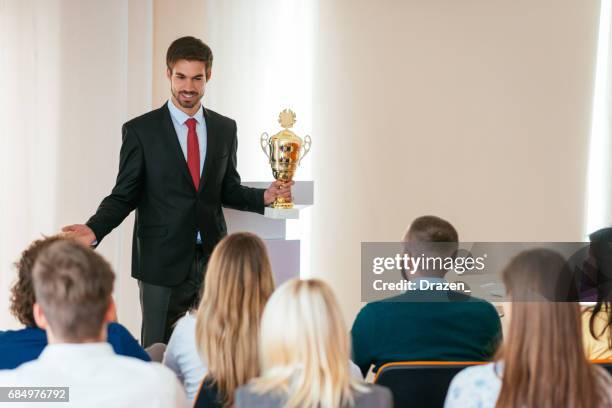 professor and students in lecture hall during the lecture - employee of the month stock pictures, royalty-free photos & images