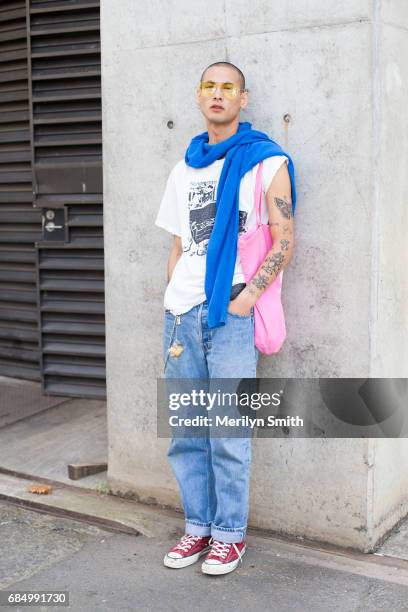 Model Luca Kiripun wearing vintage sunglasses, Number 9 t-shirt, Comme Des Garcon bag, Undercover sweater, Levi jeans and Converse shoes during...