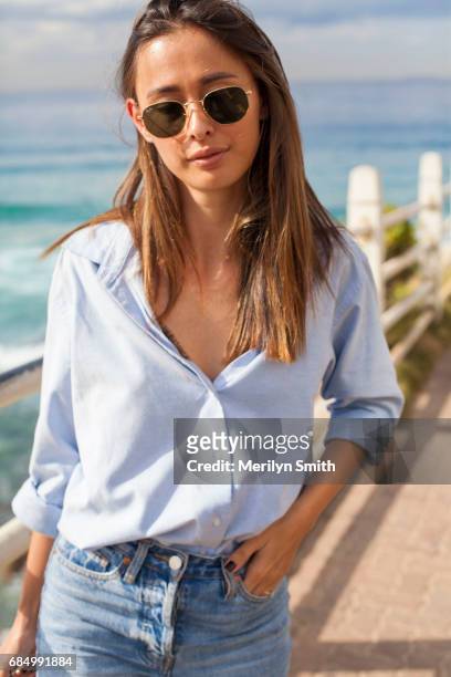 Beauty Editor for Gritty Pretty Eleanor Pendleton wearing Rayban sunglasses, her Fiance's shirt and Camilla and Marc jeans during Mercedes-Benz...