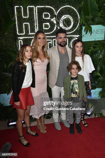 Juanes and his wife Karen Martinez pose with their children at the premiere of 'The Juanes Effect' at Faena Forum on May 18, 2017 in Miami Beach,...