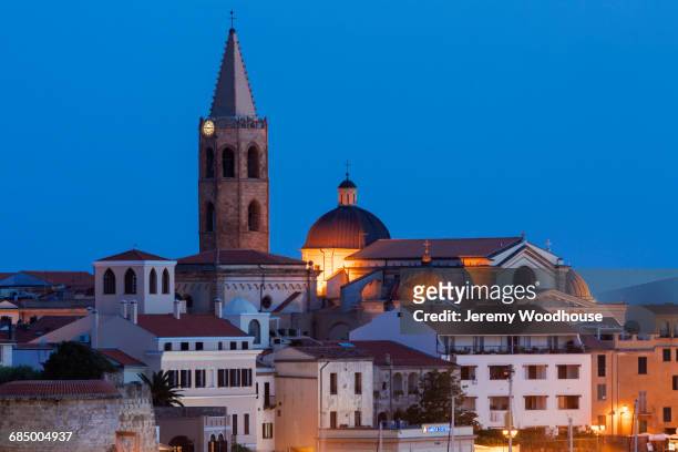 illuminated cityscape at night, alghero, provincia di sassari, italy - alghero stock pictures, royalty-free photos & images