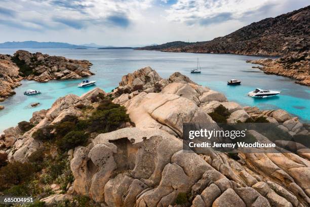 boats in rocky cove, maddalena archipelago, provincia di olbia-tempio, italy - inlet stock pictures, royalty-free photos & images