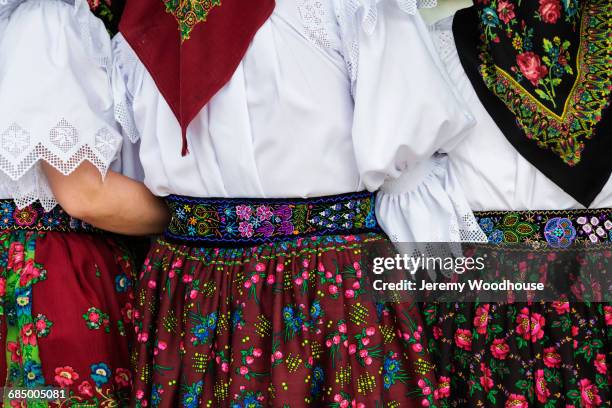 women arm in arm wearing traditional clothing - maramureș stock pictures, royalty-free photos & images