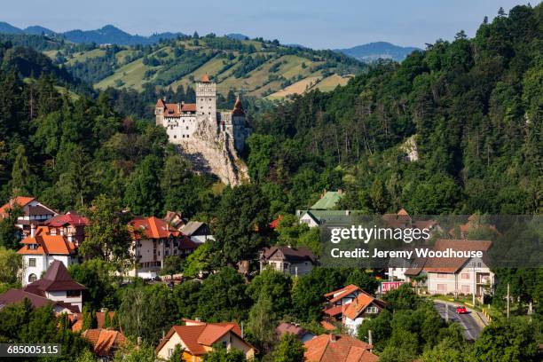 houses and castle in valley, bran, transylvania, romania - rumänien stock-fotos und bilder