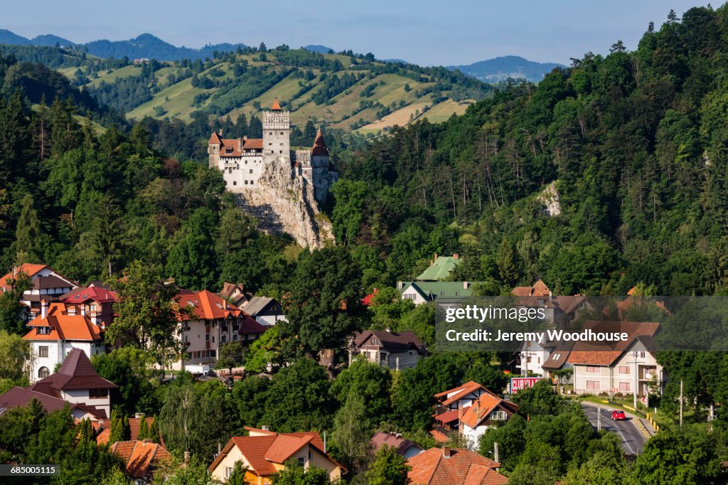 Houses and castle in valley, Bran, Transylvania, Romania