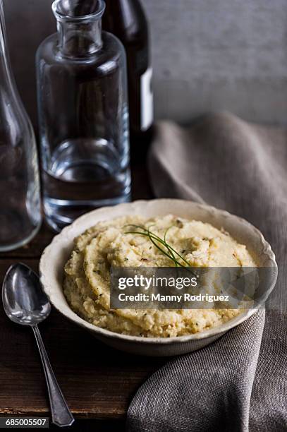 bowl of cheese grits - grits stock pictures, royalty-free photos & images