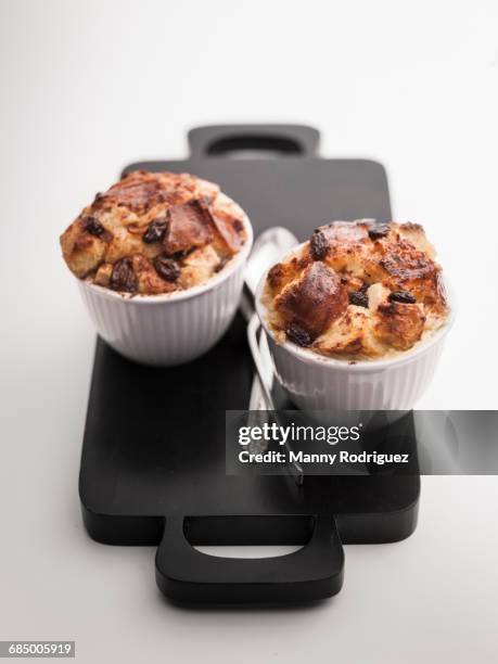 cups of apple raisin bread pudding - bread dessert stock pictures, royalty-free photos & images