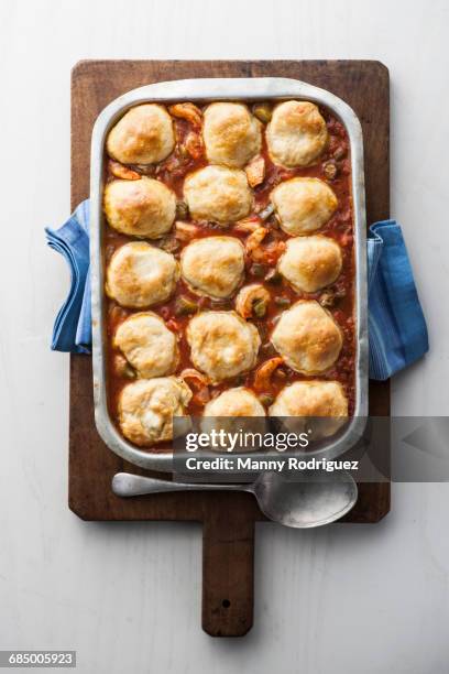 dumplings gumbo in pan on cutting board - stew stock pictures, royalty-free photos & images