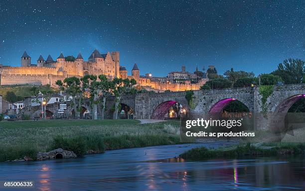 stars at night over fortified city of carcassonne, languedoc-roussillon, france - carcassonne imagens e fotografias de stock