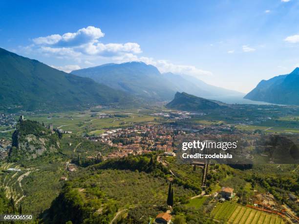 aerial view of lake valleyand lake of garda, italy - arco alto adige stock pictures, royalty-free photos & images