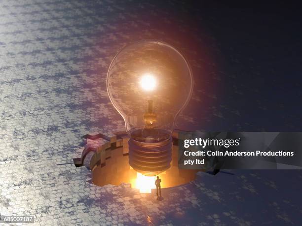 man admiring enormous floating light bulb - the big friendly giant film 2016 stock-fotos und bilder