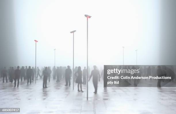 silhouette of crowd under security surveillance - målgrupp bildbanksfoton och bilder