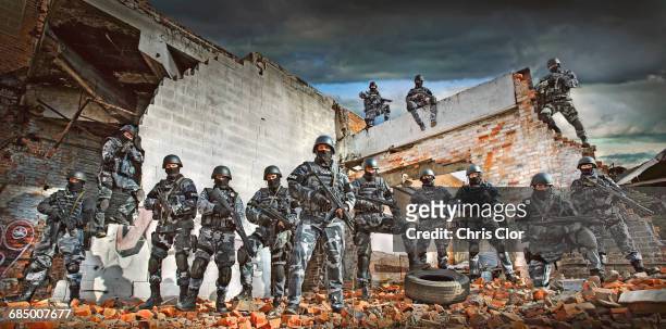 soldiers wearing masks on ruins in battlefield - detroit ruins stock pictures, royalty-free photos & images