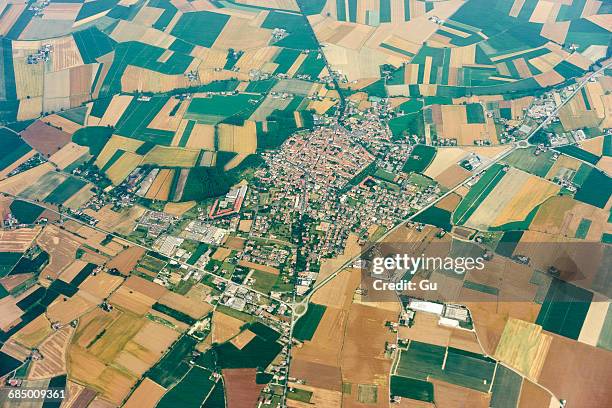 aerial view of rural village and fields near milan, italy - milan aerial stock pictures, royalty-free photos & images