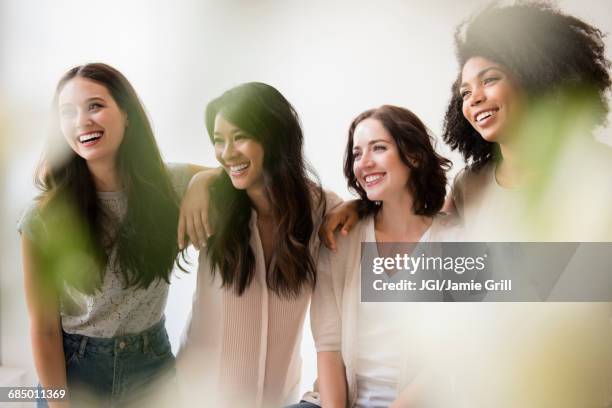 portrait of laughing women - multiracial group beauty stock pictures, royalty-free photos & images