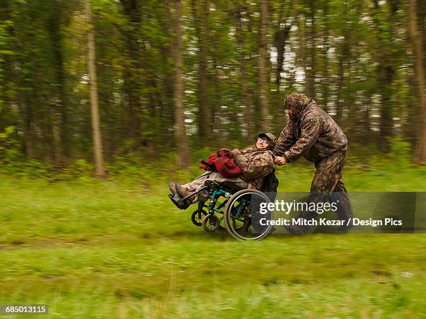 wheelchair bound hunter with turkey after successful hunt - turkey hunting fotografías e imágenes de stock