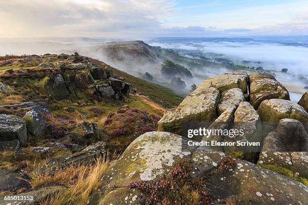 early morning fog, curbar edge with view to baslow edge, peak district national park, late summer heather, derbyshire, england, united kingdom, europe - baslow stock pictures, royalty-free photos & images