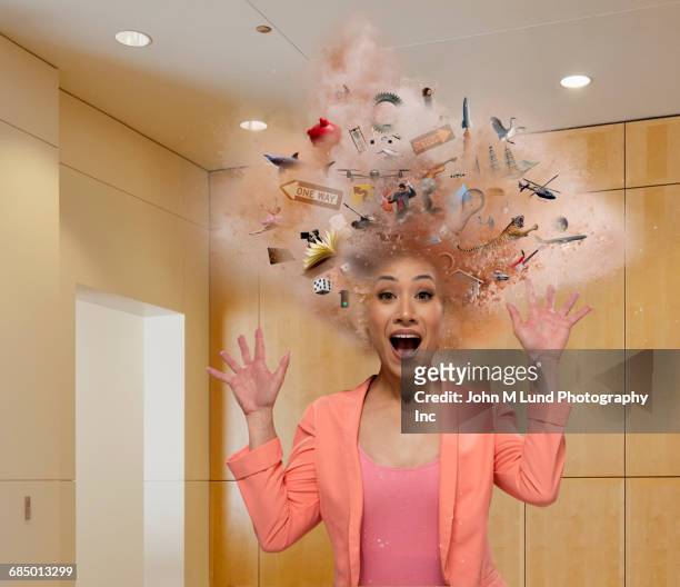 head of mixed race businesswoman exploding with ideas - wow stock-fotos und bilder