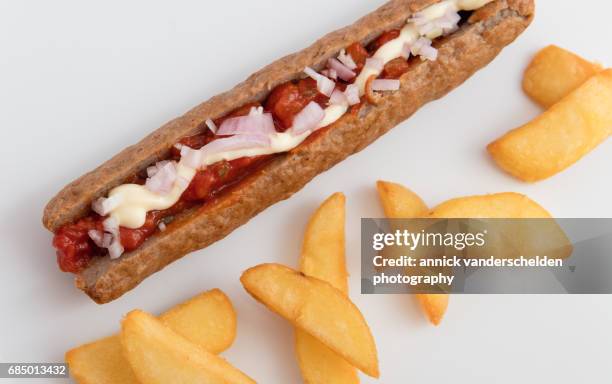 frikandel and french fries. - frikadel stock-fotos und bilder