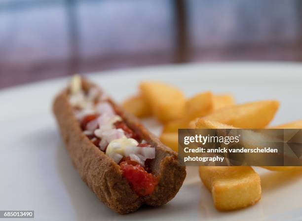 frikandel and french fries. - frikadel stock-fotos und bilder