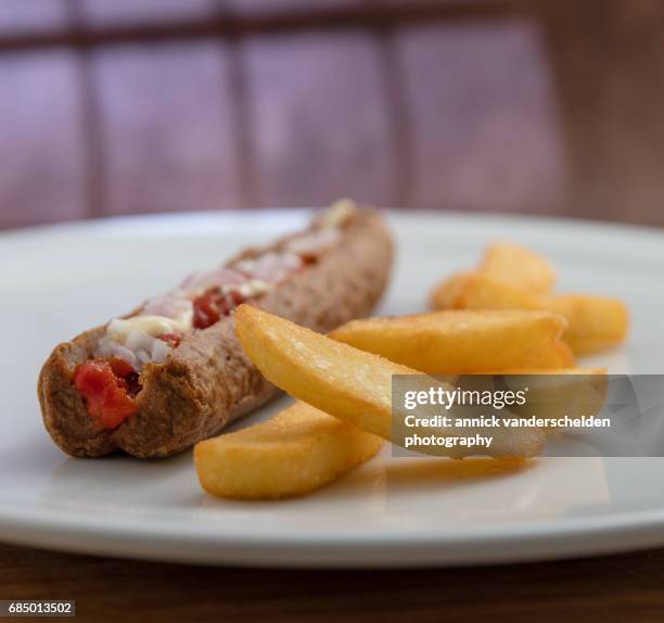 frikandel and french fries. - curryworst stock-fotos und bilder
