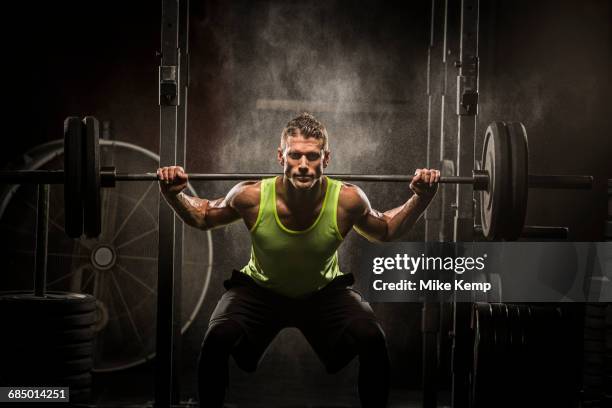 caucasian man lifting barbell in gymnasium - lehi stock pictures, royalty-free photos & images