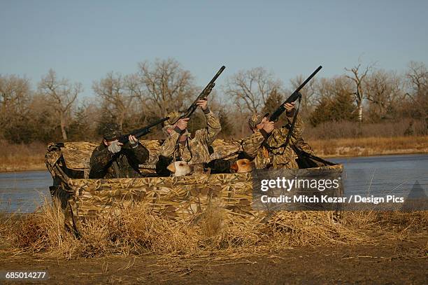 waterfowl-hunters-in-blind-