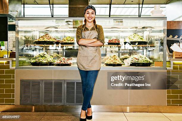 portrait of smiling mixed race worker in food court - food court stock pictures, royalty-free photos & images