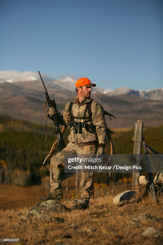 Big Game Hunter With Western Elk Rack On Back