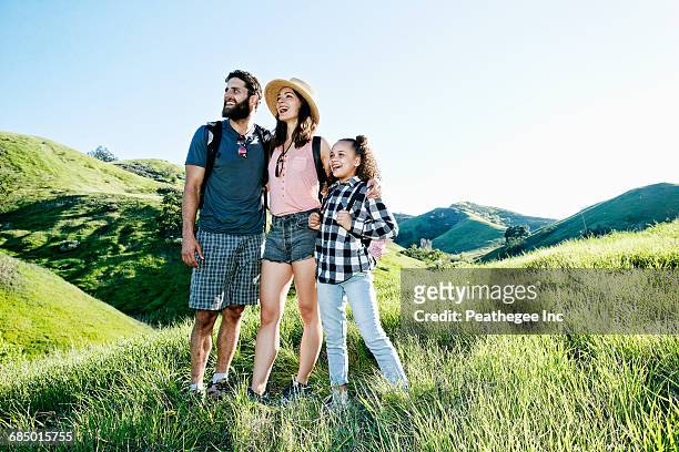 happy family standing on hill - 13 year old girls in shorts stock pictures, royalty-free photos & images