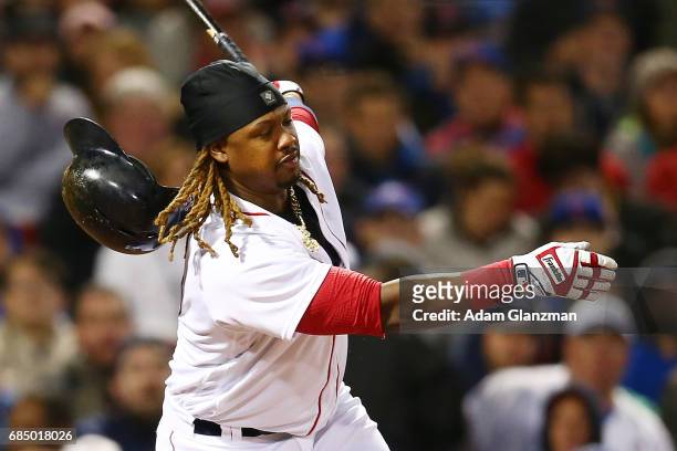 Hanley Ramirez of the Boston Red Sox loses his helmet after striking out in the sixth inning of a game against the Chicago Cubs at Fenway Park on...