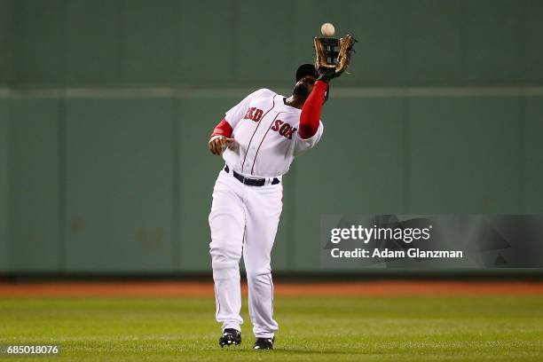 Jackie Bradley Jr. #19 of the Boston Red Sox catches a fly ball during a game against the Chicago Cubs at Fenway Park on April 30, 2017 in Boston,...