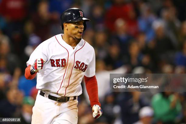 Xander Bogaerts of the Boston Red Sox pumps his fist during a game against the Chicago Cubs at Fenway Park on April 30, 2017 in Boston, Massachusetts.