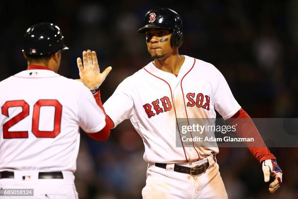 Xander Bogaerts of the Boston Red Sox reacts during a game against the Chicago Cubs at Fenway Park on April 30, 2017 in Boston, Massachusetts.