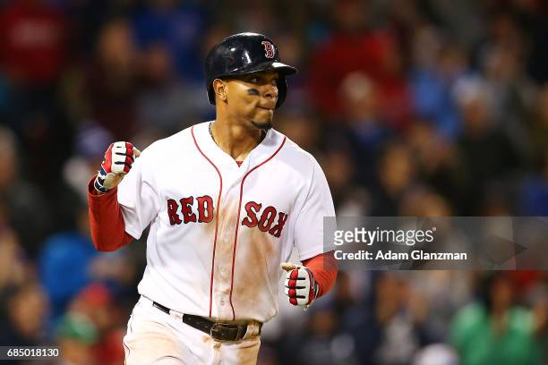 Xander Bogaerts of the Boston Red Sox pumps his fist during a game against the Chicago Cubs at Fenway Park on April 30, 2017 in Boston, Massachusetts.