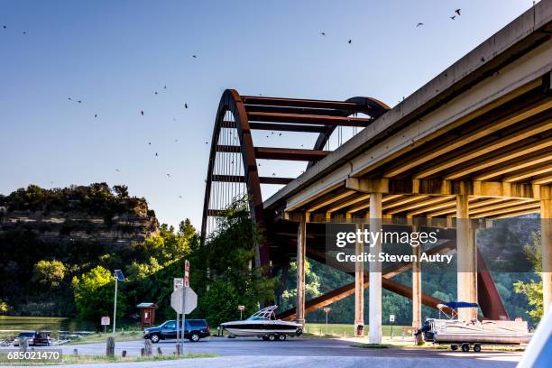 austin, tx - may 6, 2017: morning at the austin texas landmark, the highway 360 bridge.  the bridge crosses the section of the colorado river known as town lake. - 360 photograph colorado stock pictures, royalty-free photos & images