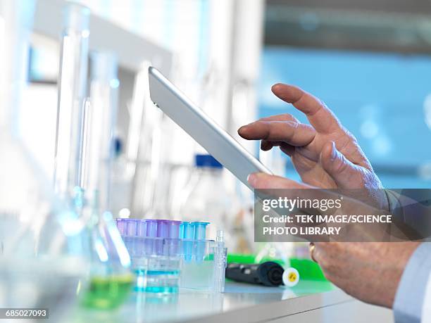 scientist using a digital tablet - insulin molecule stock illustrations
