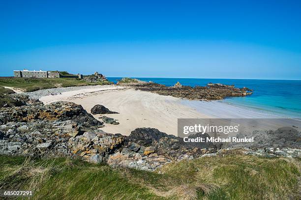 corblets bay with chateau a letoc (chateau le toc), alderney, channel islands, united kingdom, europe - island of alderney stock pictures, royalty-free photos & images